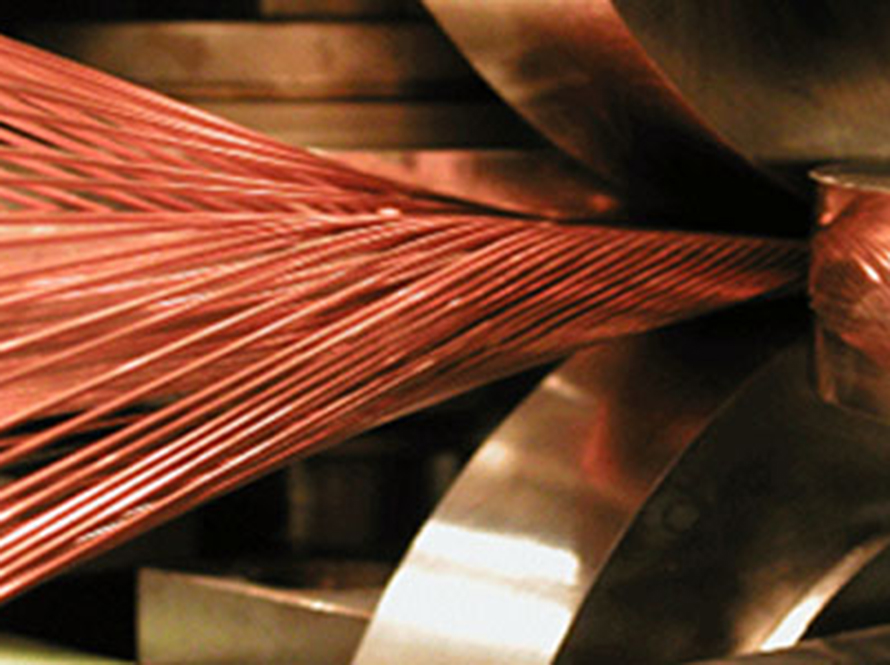 Weaving superconductor into cables.