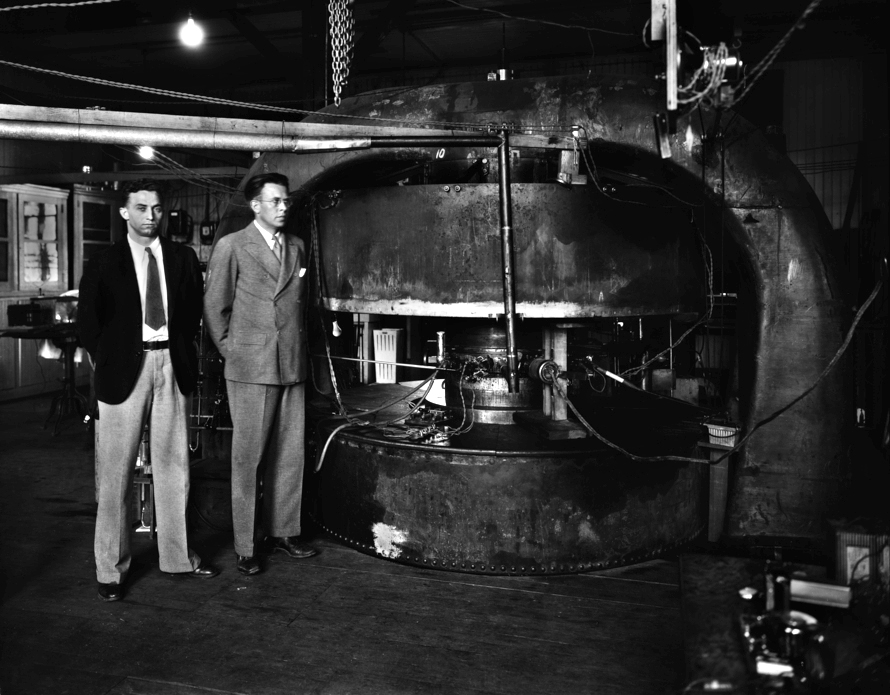 M.S. Livingston and Ernest Orlando Lawrence standing beside the 27-inch cyclotron, built in 1934.