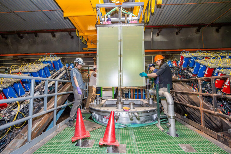 Fermilab press release image: The crew moved the 2×2 prototype into place for insertion into the liquid argon cryostat, where it will collect data in the NuMI neutrino beam. Photo: Dan Svoboda, Fermilab