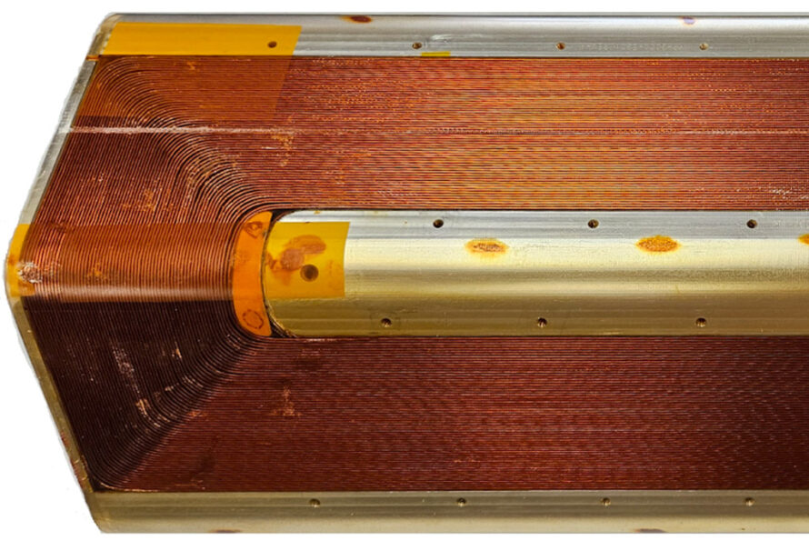 The completed NbTi 4 layer test coil is shown after epoxy impregnation is completed.