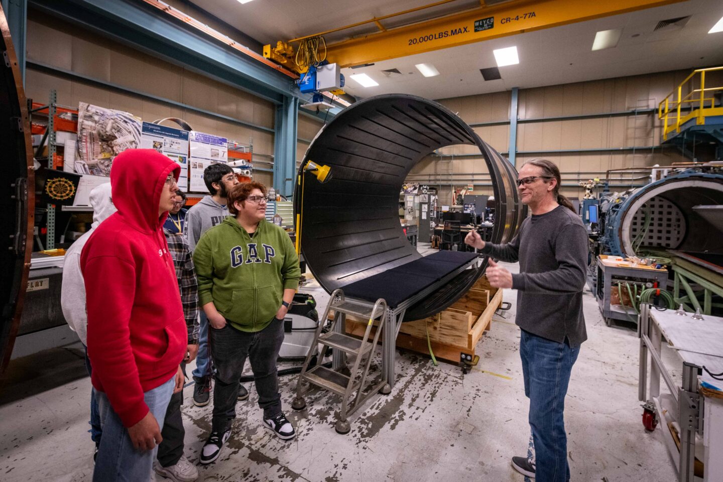 Tom Johnson, an engineering technical associate, showcased the carbon fiber support structures for the ATLAS Upgrade ITk outer barrel. (Photo by Thor Swift, Berkeley Lab)