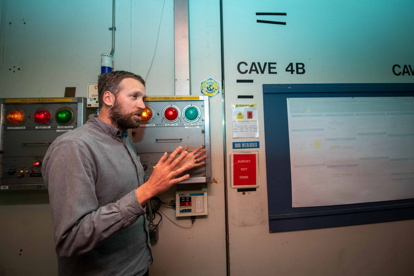 Alex Donoghue, a scientific engineering associate in the Nuclear Science Division, discusses the Berkeley Accelerator Space Effects (BASE) Facility and the many types of devices and companies that test their equipment at the 88-Inch Cyclotron. (Photo by Thor Swift, Berkeley Lab)