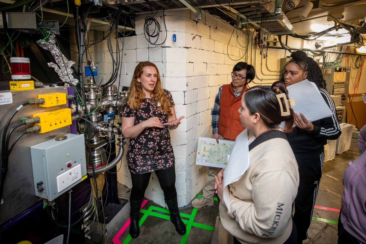 At the 88-Inch Cyclotron, Jennifer Pore, a research scientist in the Nuclear Science Division, explained the operation of the FIONA mass analyzer (For the Identification Of Nuclide A), pictured above, and the BGS (Berkeley Gas-filled Separator), which the Heavy Element Group uses in making and understanding superheavy elements. (Photo by Thor Swift, Berkeley Lab)
