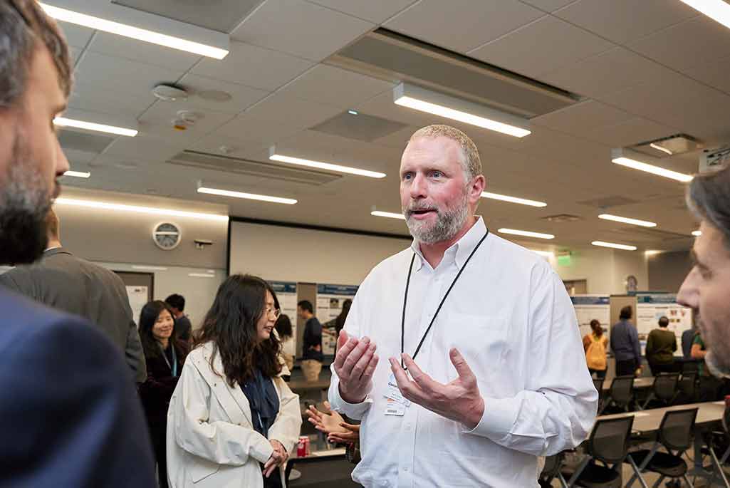 Cameron Geddes speaks with some of the presenters during the poster session – 2024 Berkeley Lab Director’s Review of the Physics and ATAP Divisions – Photo by Tue Nam Ton 