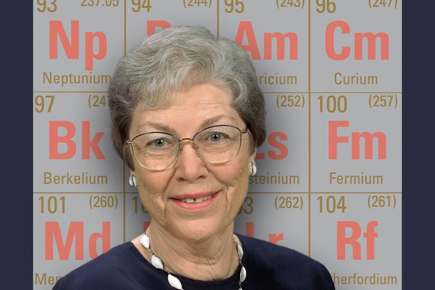 Darleane Hoffman with the Periodic Table of Elements that were discovered at Berkeley Lab. (Credit: Roy Kaltschmidt, Berkeley Lab)