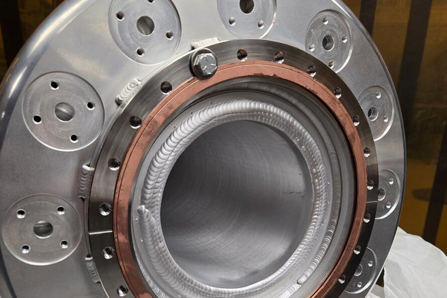 An up close view of the flange for the fourth-generation VENUS plasma chamber. The device was made in-house by the Engineering Division’s highly skilled technicians. Credit: Kris Pearson, Berkeley Lab