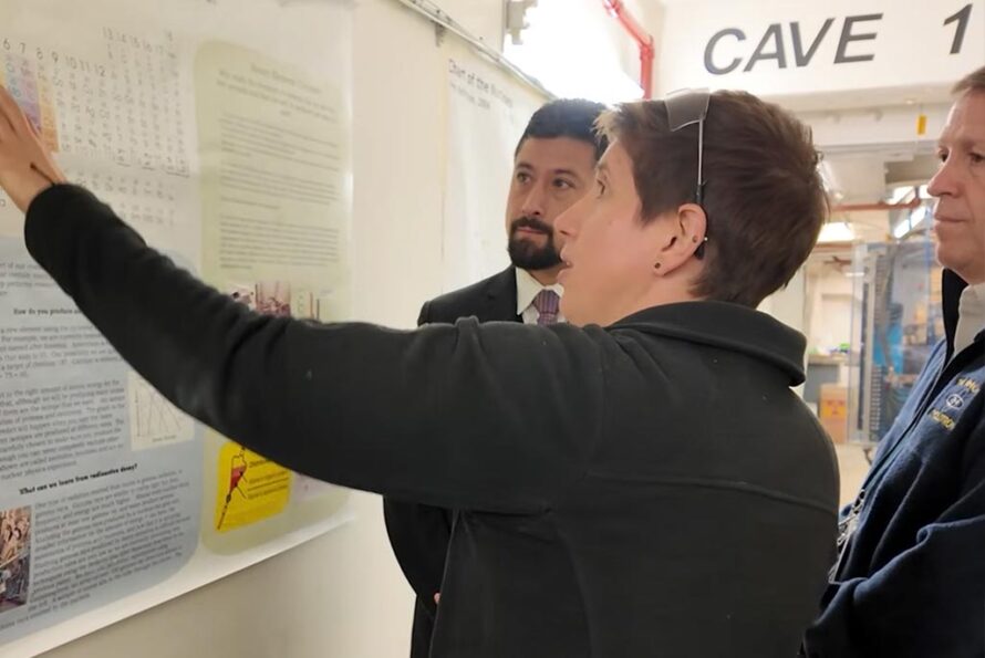 Jacklyn Gates, a Berkeley Lab nuclear scientist whose team is leading the search for element 120, explains the process of superheavy element discovery at the 88-Inch Cyclotron. From left to right: Dan Marrujo, Jacklyn Gates, and Larry Phair.