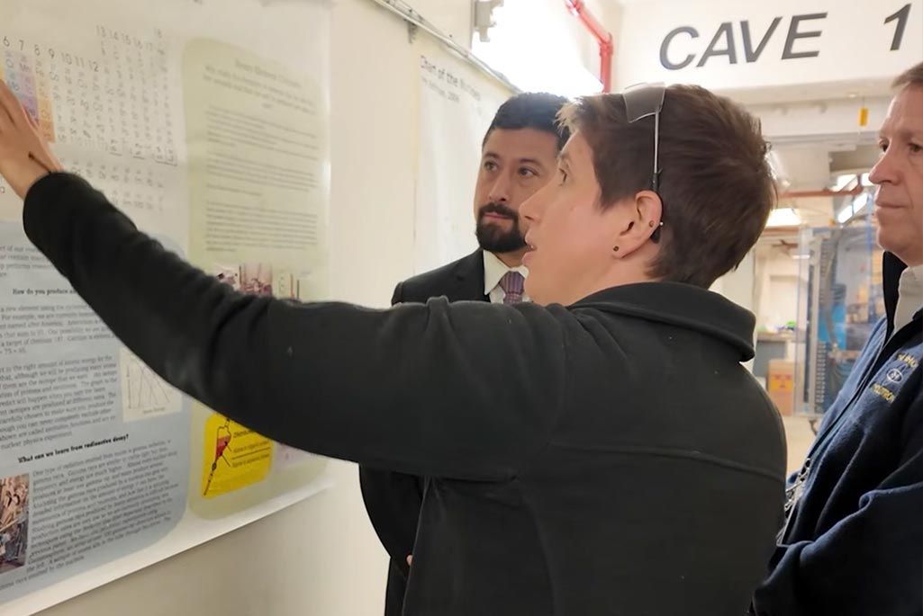 Jacklyn Gates, a Berkeley Lab nuclear scientist whose team is leading the search for element 120, explains the process of superheavy element discovery at the 88-Inch Cyclotron. From left to right: Dan Marrujo, Jacklyn Gates, and Larry Phair.