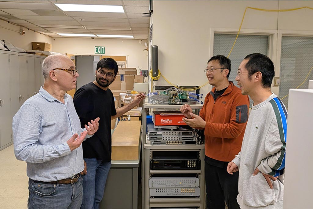 Jan Balewski, Neel Vora, Gang Huang, and Yilun Xu discuss their method for modeling crosstalk in a multi-qubit superconducting quantum processor. (Credit: Matthew Fullmer, Berkeley Lab)