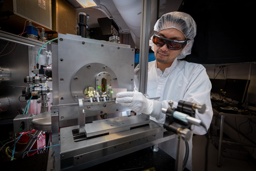 Kei Nakamura aims a targeting laser at Berkeley Lab Laser Accelerator (BELLA) Center, which uses machine learning models to optimize beams, improvements that have the potential for broader scientific and industrial applications. (Credit: Thor Swift/Berkeley Lab)
