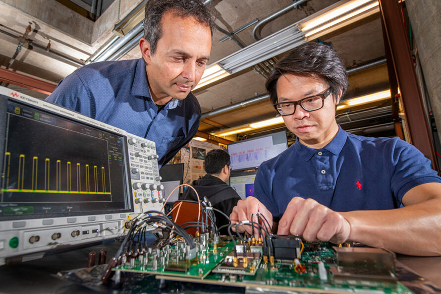 Arun Persaud, head of ATAP’s Fusion Science & Ion Beam Technology Program (left) and Wei Liu, a project scientist in the Berkeley Accelerator Controls and Instrumentation Program (right), use a controller for a quantum readout experiment. (Credit: Robinson Kuntz, Berkeley Lab)