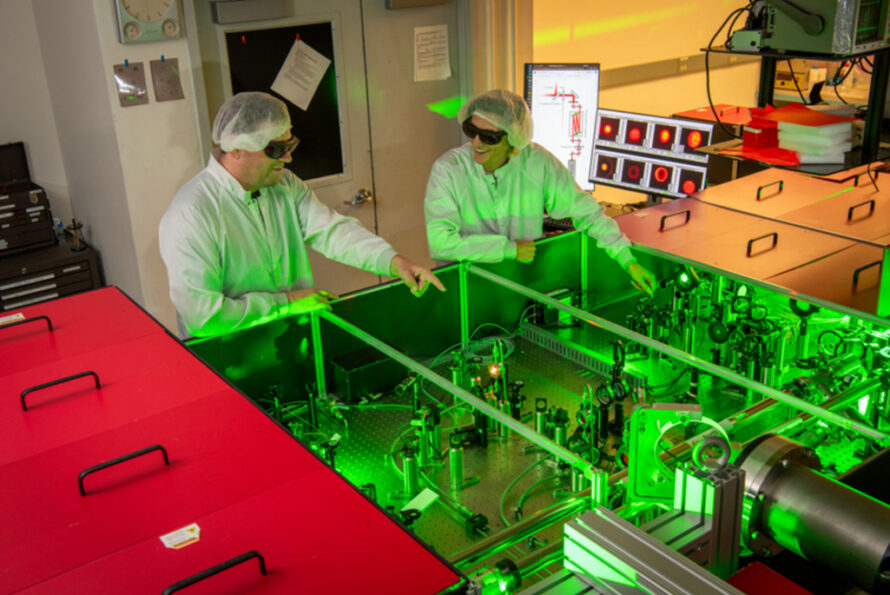 BELLA Center staff scientist Samuel Barber (left) and postdoctoral researcher Finn Kohrell (right) working in BELLA's high-power laser facility. (Credit: Robinson Kuntz, Berkeley Lab)
