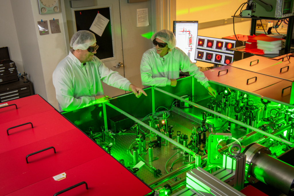 BELLA Center staff scientist Samuel Barber (left) and postdoctoral researcher Finn Kohrell (right) working in BELLA's high-power laser facility. (Credit: Robinson Kuntz, Berkeley Lab)