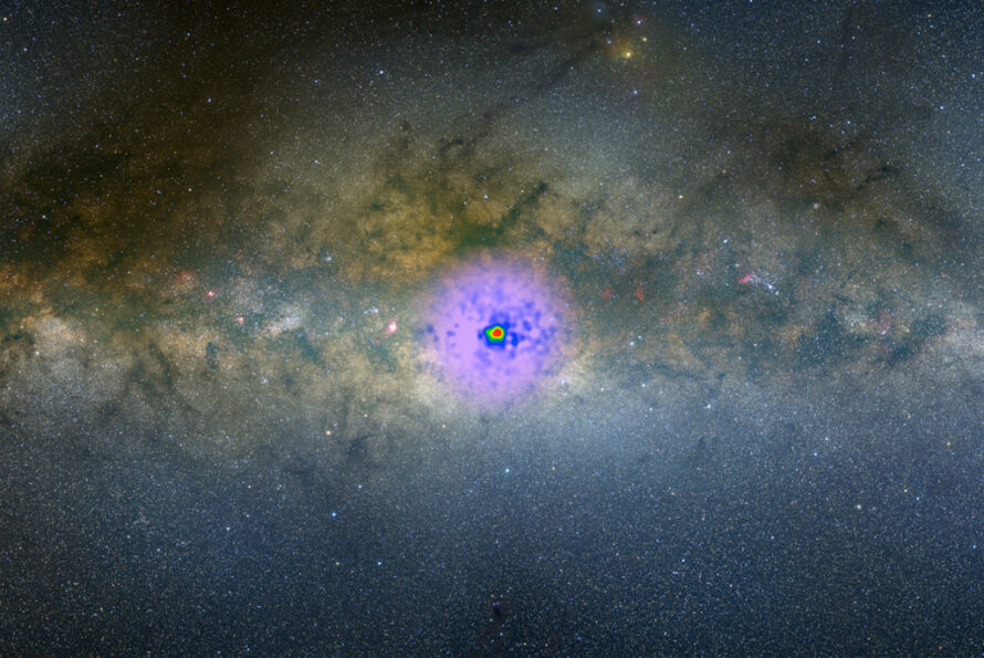 An image of the surprising excess of gamma-rays emerging at the center of our Milky Way, superimposed on an optical image of the galaxy. The nature of the excess and whether it could be originating from dark matter has been debated for over a decade." Credit: NASA Goddard/A. Mellinger (Central Michigan Univ.) and T. Linden (Univ. of Chicago)