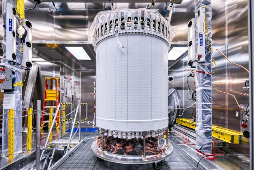 LUX-ZEPLIN’s central detector in the clean room at the Sanford Underground Research Facility, after assembly and before beginning its journey underground. The white cylinder is the time projection chamber’s field cage. (Credit: Matthew Kapust, Sanford Underground Research Facility)