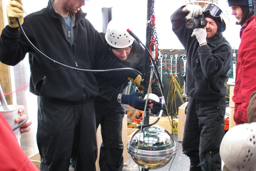 An IceCube digital optical module attached to it’s cable, ready to be lowered 2.4 kilometers into its final location in the South Polar icecap. The sensor electronics were designed and built at Berkeley Lab. Photographer: Spencer Klein, Berkeley Lab